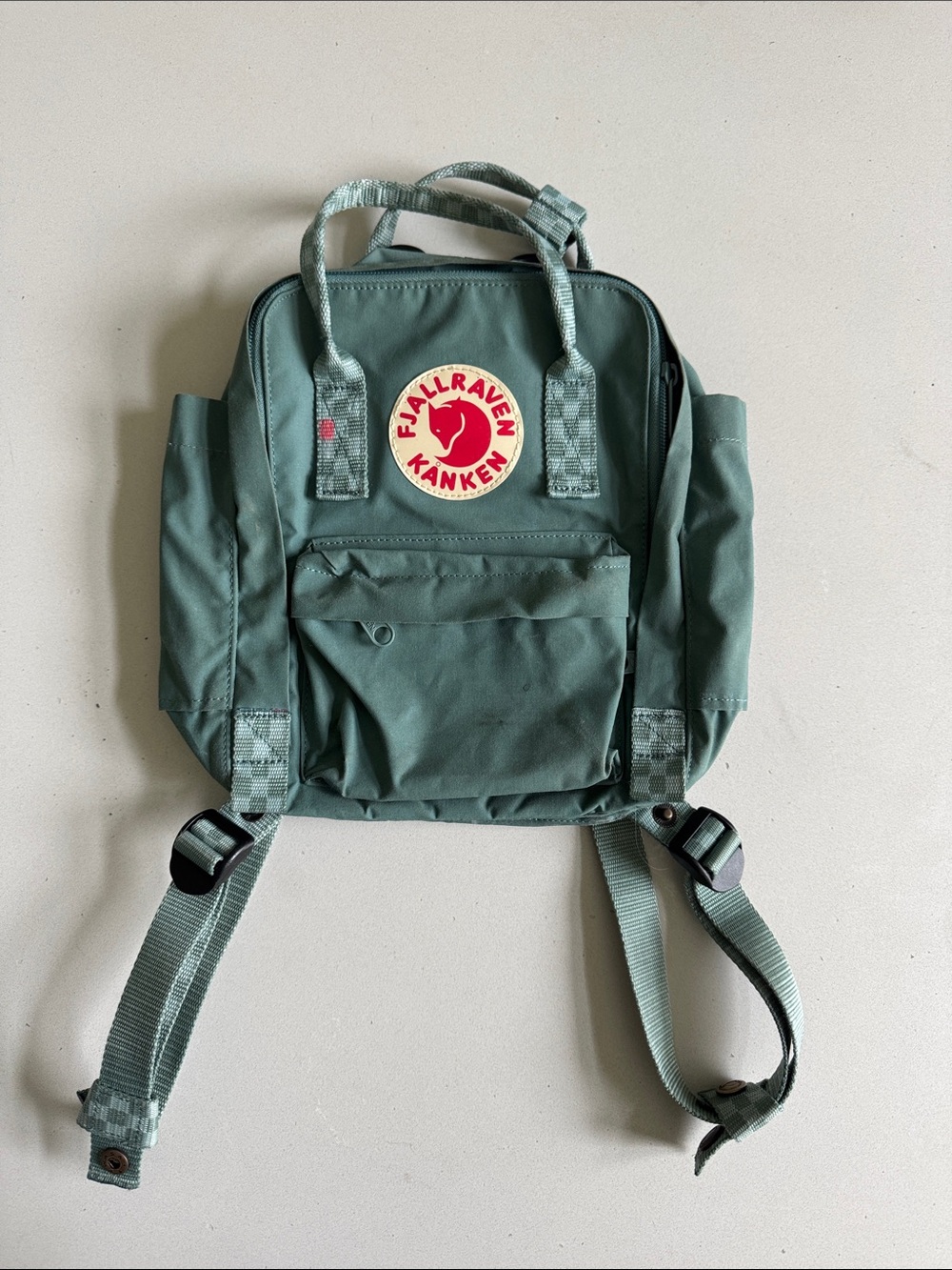 Fjallraven Kanken Mini Backpack in Green with Red Logo